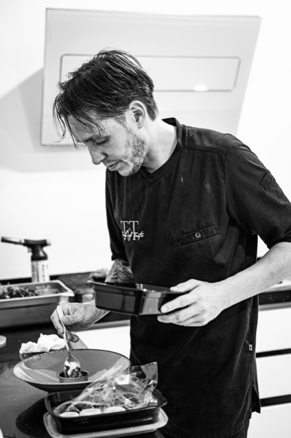 Chef René plating a dish